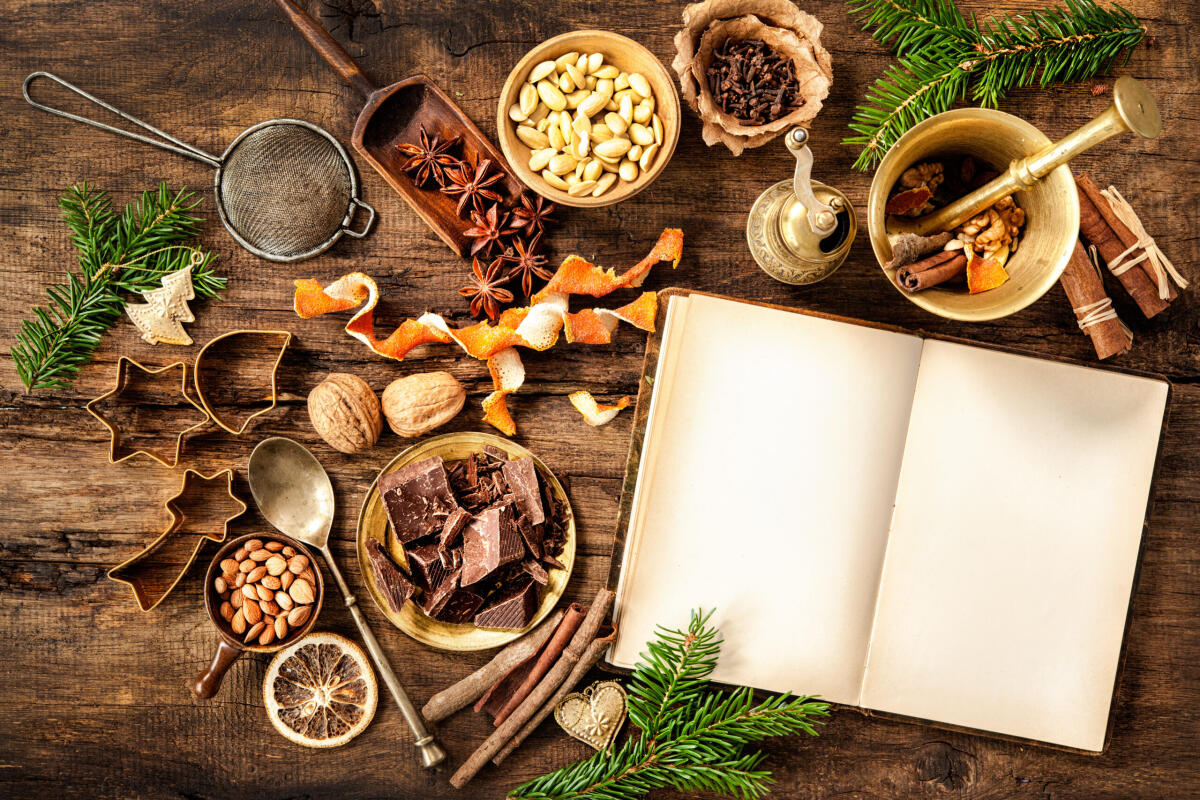 Panforte senese - Baking concept background with cookbook, spices and utensils for Christmas cookies