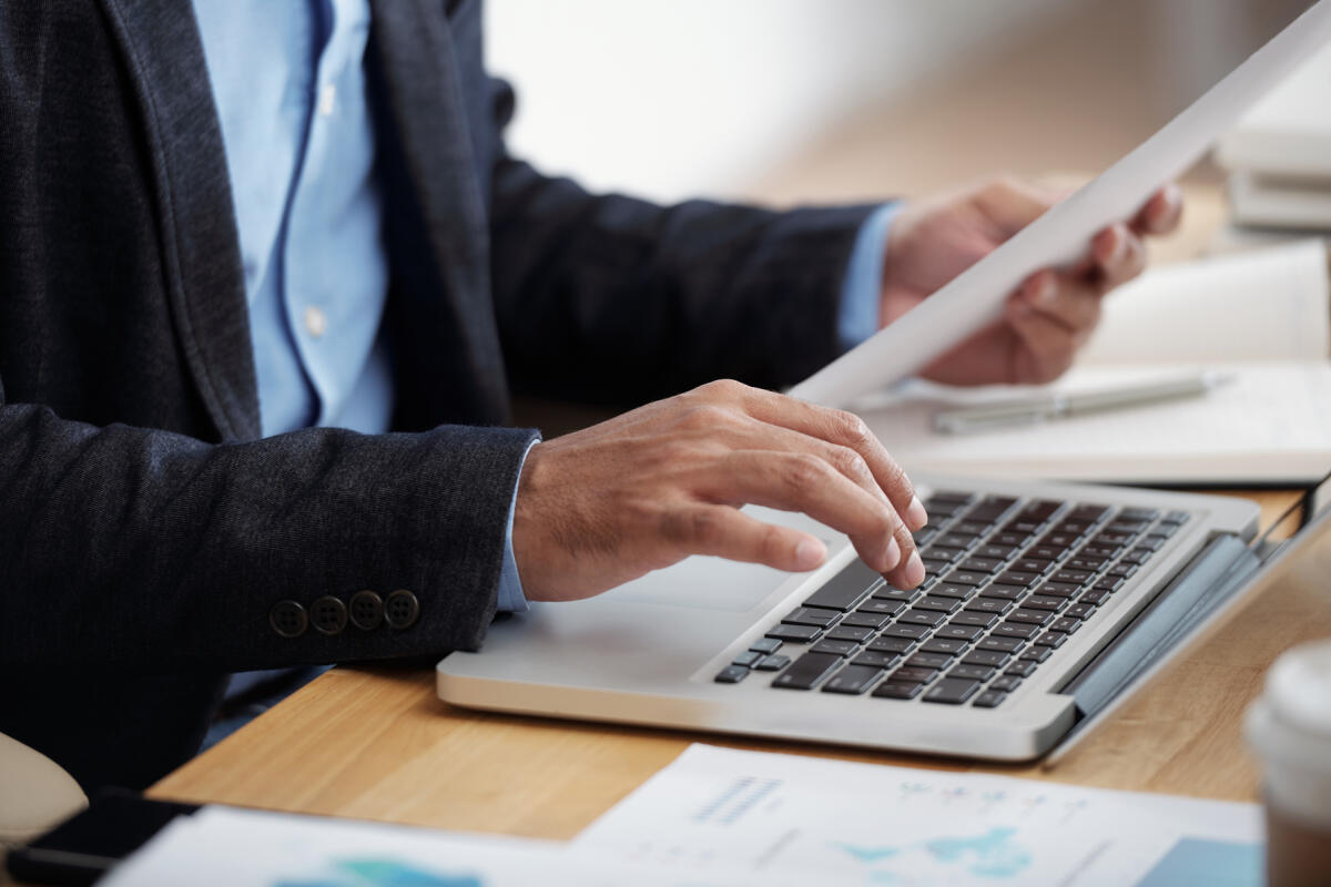 San Severo, basta certificati cartacei: servizio di stato civile informatizzato - Hands of businessman checking document and typing on keyboard