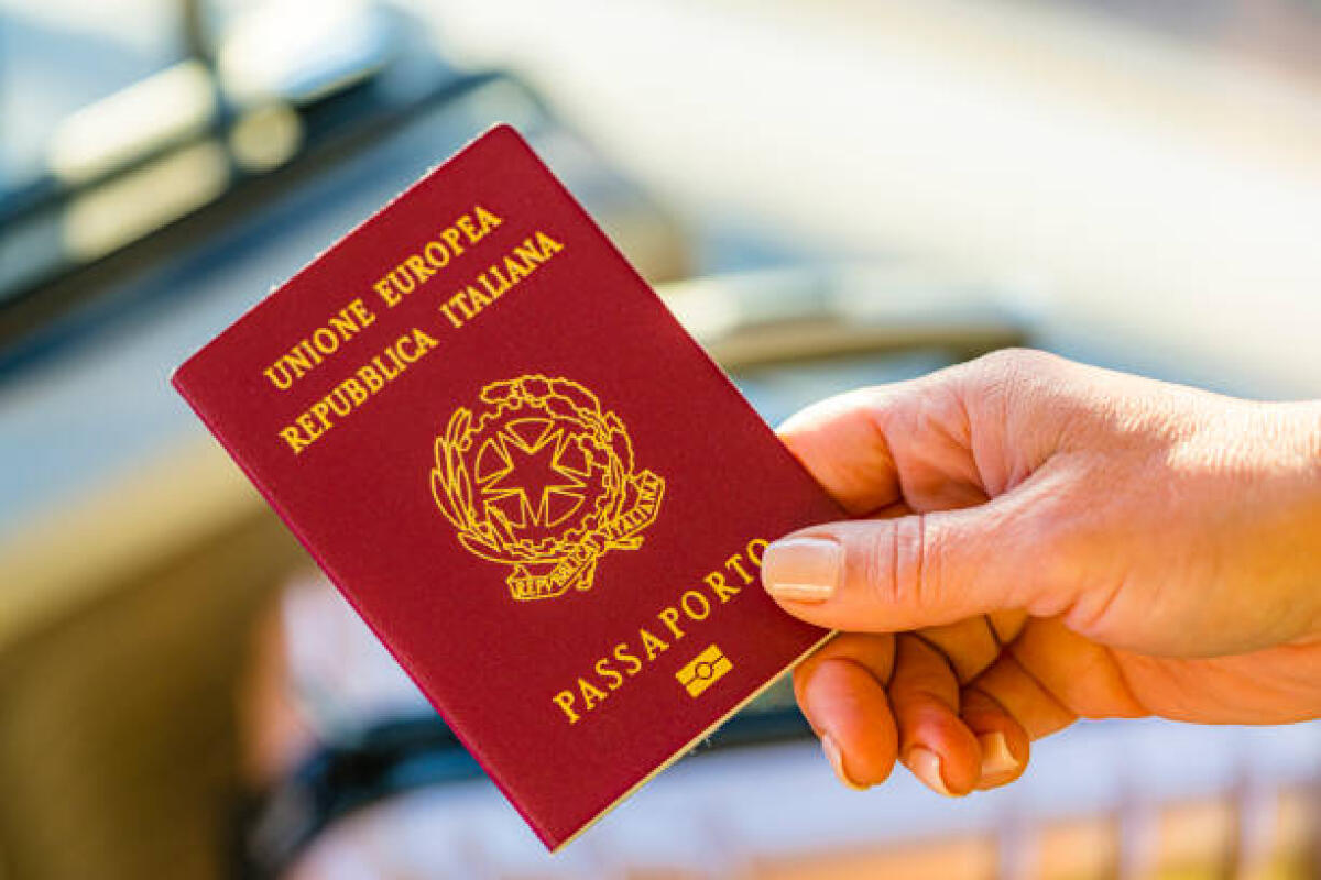 Progetto Polis: passaporto negli uffici postali dei Comuni della provincia di Foggia con meno di  15.000 abitanti - Close up of woman hand holding Italian passport. High resolution 42Mp indoors digital capture taken with Sony A7rII and Sony FE 90mm f2.8 macro G OSS lens